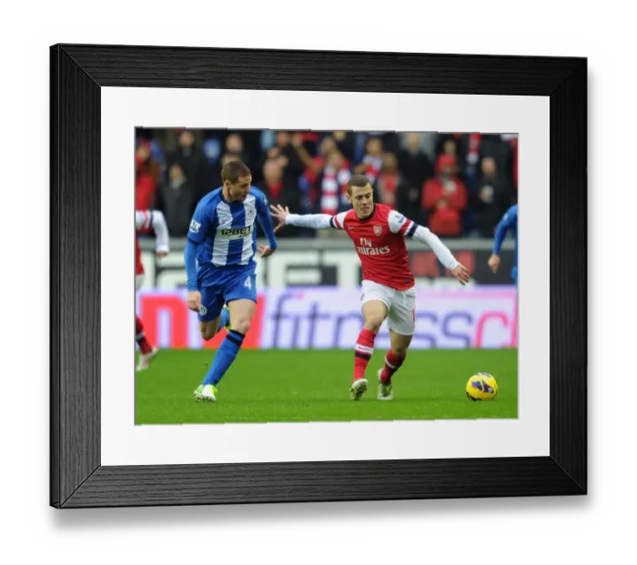 Framed Print : Jack Wilshere (Arsenal) James McCarthy (Wigan). Wigan Athletic 0: 1 Arsenal. Barclays Premier League