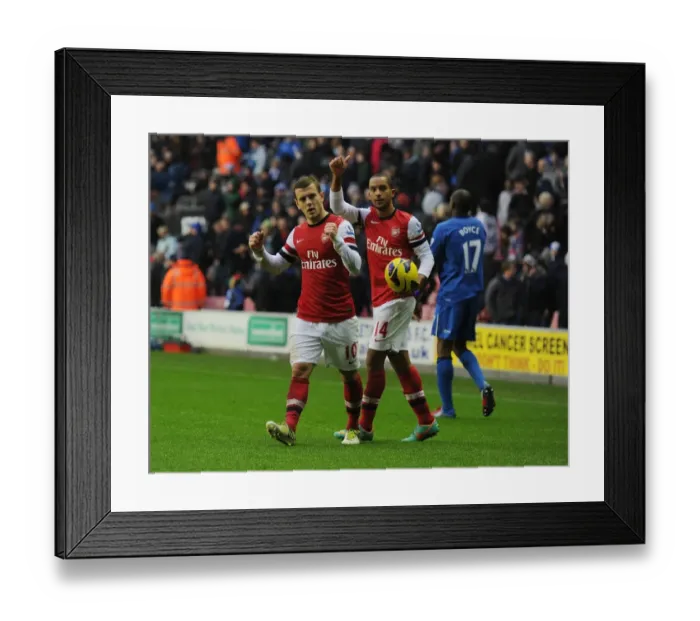 Framed Print : Arsenal's Hard-Fought Victory over Wigan Athletic (2012-13): Jack Wilshere and Theo Walcott Celebrate