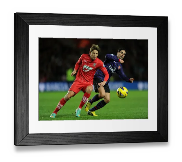 Framed Print : Clash at St. Mary's: Mikel Arteta Stifles Gaston Ramirez's Threat (Southampton v Arsenal, Premier League 2012-13) Framed Print : Clash at St. Mary's: Mikel Arteta Stifles Gaston Ramirez's Threat (Southampton v Arsenal, Premier League 2012-13)