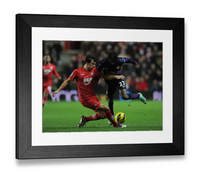Framed Print : Gervinho vs Jack Cork: Stalemate at St. Mary's - Arsenal vs Southampton, Barclays Premier League Framed Print : Gervinho vs Jack Cork: Stalemate at St. Mary's - Arsenal vs Southampton, Barclays Premier League