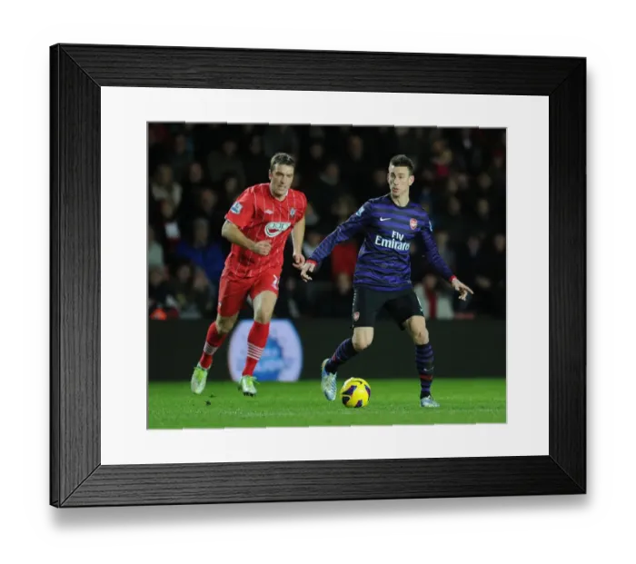 Framed Print : Koscielny vs Lambert: Intense Battle at Southampton's St Marys Stadium (Arsenal vs Southampton 2012-13)