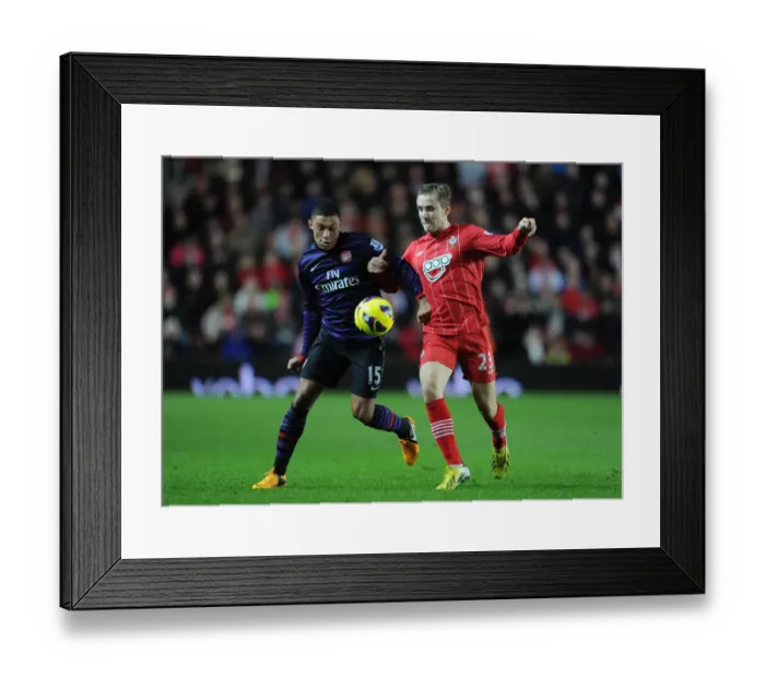 Framed Print : Clash of Young Stars: Oxlade-Chamberlain vs Shaw in Southampton v Arsenal, Premier League (2012-13)