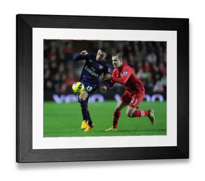 Framed Print : Arsenal's Alex Oxlade-Chamberlain Faces Off Against Southampton's Luke Shaw in Premier League Clash Framed Print : Arsenal's Alex Oxlade-Chamberlain Faces Off Against Southampton's Luke Shaw in Premier League Clash