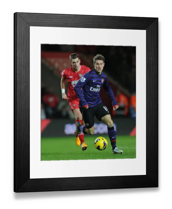 Framed Print : Aaron Ramsey (Arsenal) Morgan Schneiderlin (Southampton). Southampton 1: 1 Arsenal Framed Print : Aaron Ramsey (Arsenal) Morgan Schneiderlin (Southampton). Southampton 1: 1 Arsenal