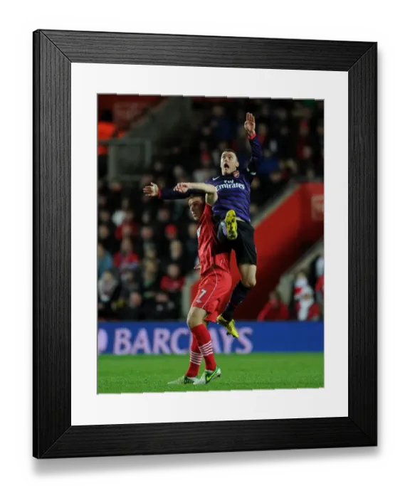 Framed Print : Thomas Vermaelen Leaps Above Rickie Lambert: Southampton vs. Arsenal, Premier League 2012-13 Framed Print : Thomas Vermaelen Leaps Above Rickie Lambert: Southampton vs. Arsenal, Premier League 2012-13