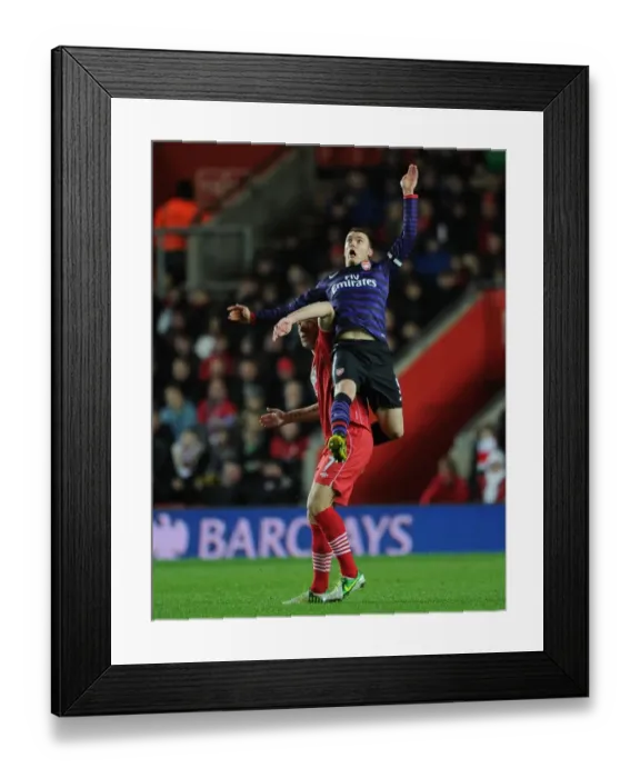 Framed Print : Thomas Vermaelen Soaring Above Rickie Lambert: Arsenal vs. Southampton, Premier League 2012-13 - Aerial Battle Framed Print : Thomas Vermaelen Soaring Above Rickie Lambert: Arsenal vs. Southampton, Premier League 2012-13 - Aerial Battle
