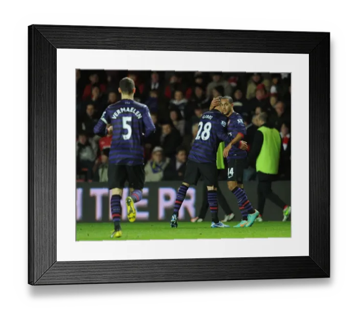 Framed Print : Theo Walcott (Arsenal) is congratulated on the cross that lead to the Arsenal goal