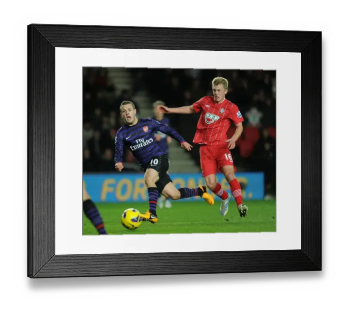 Framed Print : Jack Wilshere vs. James Ward-Prowse: Intense Midfield Battle at Southampton v Arsenal (2012-13) Framed Print : Jack Wilshere vs. James Ward-Prowse: Intense Midfield Battle at Southampton v Arsenal (2012-13)