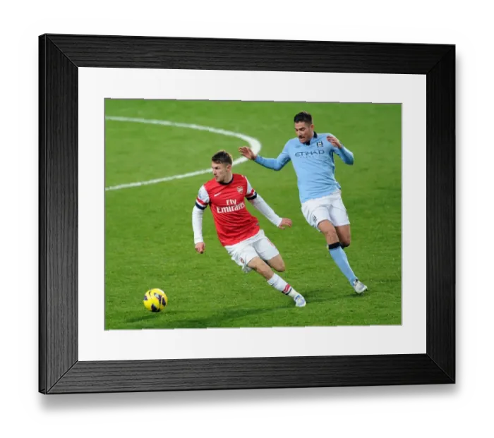 Framed Print : Arsenal's Aaron Ramsey Fends Off Manchester City's Javi Garcia in Intense Premier League Clash