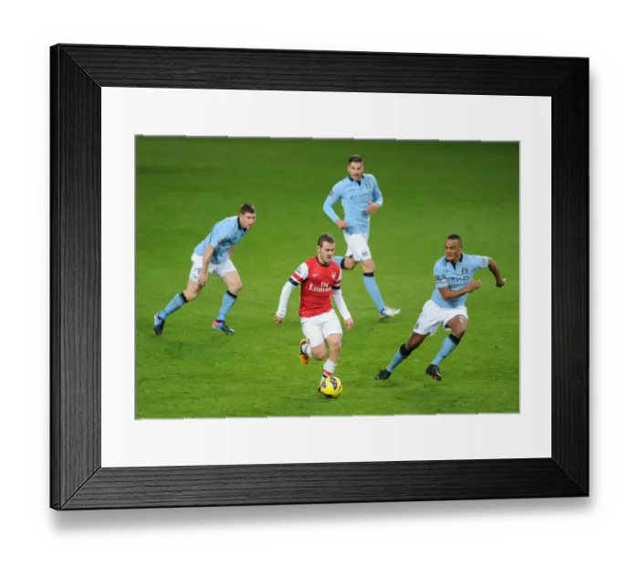 Framed Print : Arsenal's Jack Wilshere Faces Off Against Manchester City's Milner, Garcia, and Kompany Framed Print : Arsenal's Jack Wilshere Faces Off Against Manchester City's Milner, Garcia, and Kompany