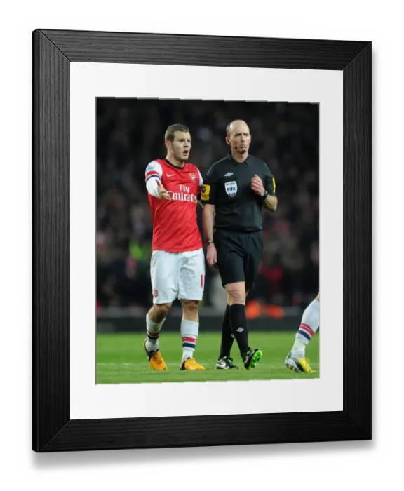 Framed Print : Mike Dean and Jack Wilshere: A Moment of Discussion during Arsenal vs Manchester City (2012-13) Framed Print : Mike Dean and Jack Wilshere: A Moment of Discussion during Arsenal vs Manchester City (2012-13)