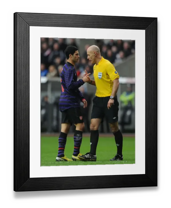 Framed Print : Mikel Arteta Conferring with Referee Howard Webb during Swansea vs Arsenal FA Cup Match Framed Print : Mikel Arteta Conferring with Referee Howard Webb during Swansea vs Arsenal FA Cup Match