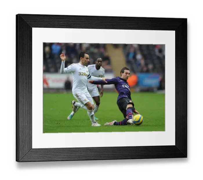 Framed Print : Santi Cazorla Outmaneuvers Leon Britton: Swansea v Arsenal - FA Cup Third Round