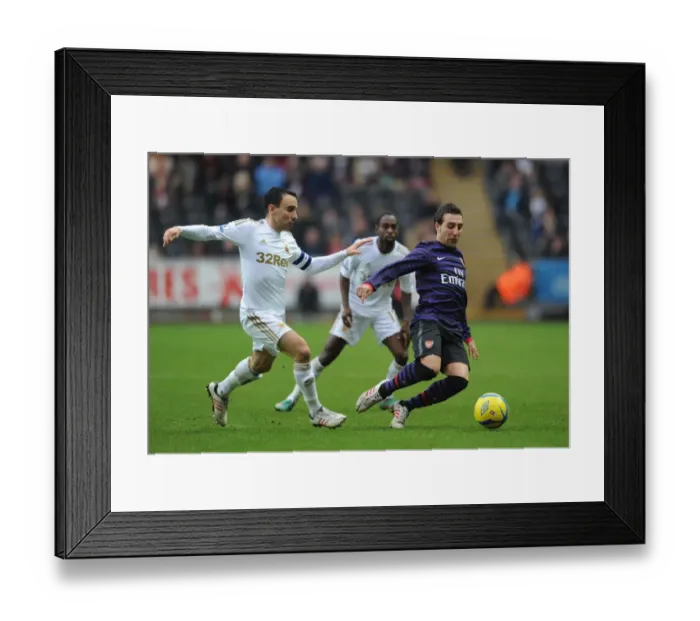 Framed Print : Santi Cazorla Outsmarts Leon Britton: FA Cup Third Round Battle Framed Print : Santi Cazorla Outsmarts Leon Britton: FA Cup Third Round Battle