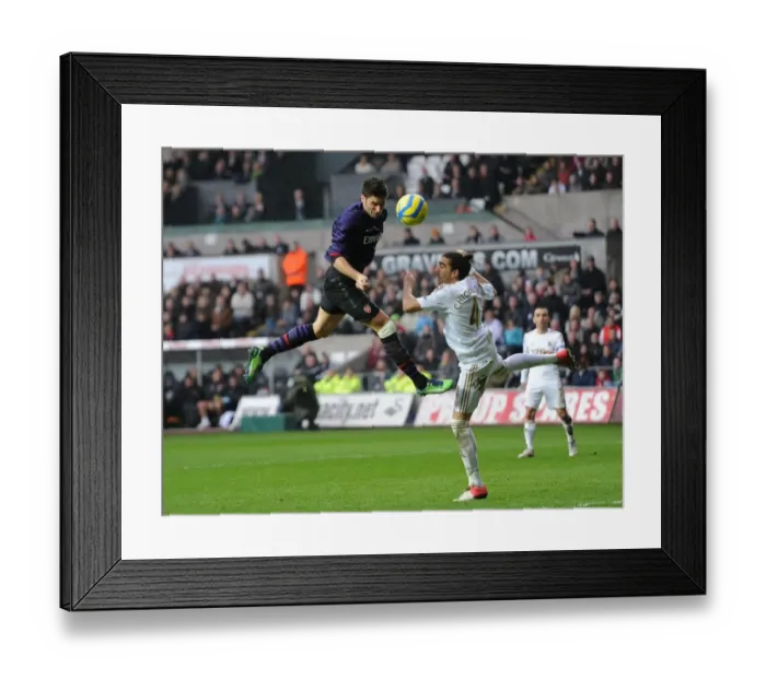 Framed Print : Head-to-Head: Giroud vs. Flores - Swansea v Arsenal, FA Cup 3rd Round