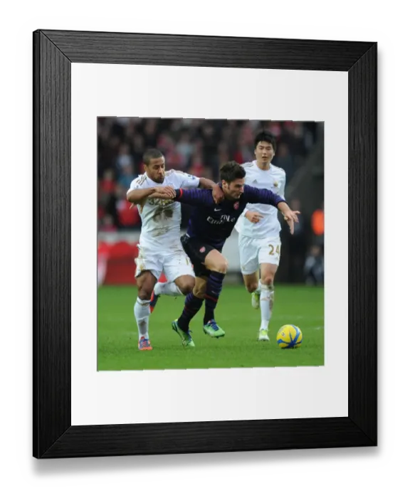 Framed Print : Giroud vs Routledge: A FA Cup Battle at Swansea's Liberty Stadium Framed Print : Giroud vs Routledge: A FA Cup Battle at Swansea's Liberty Stadium