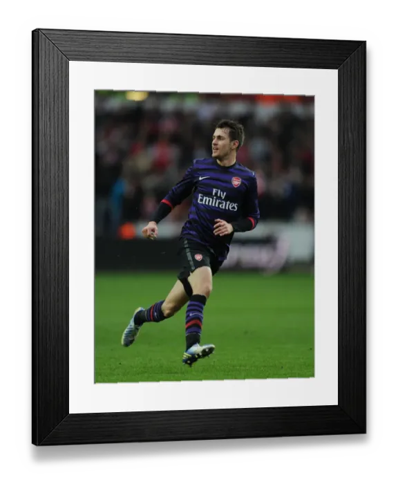 Framed Print : Aaron Ramsey in Action: Swansea v Arsenal - FA Cup Third Round Framed Print : Aaron Ramsey in Action: Swansea v Arsenal - FA Cup Third Round