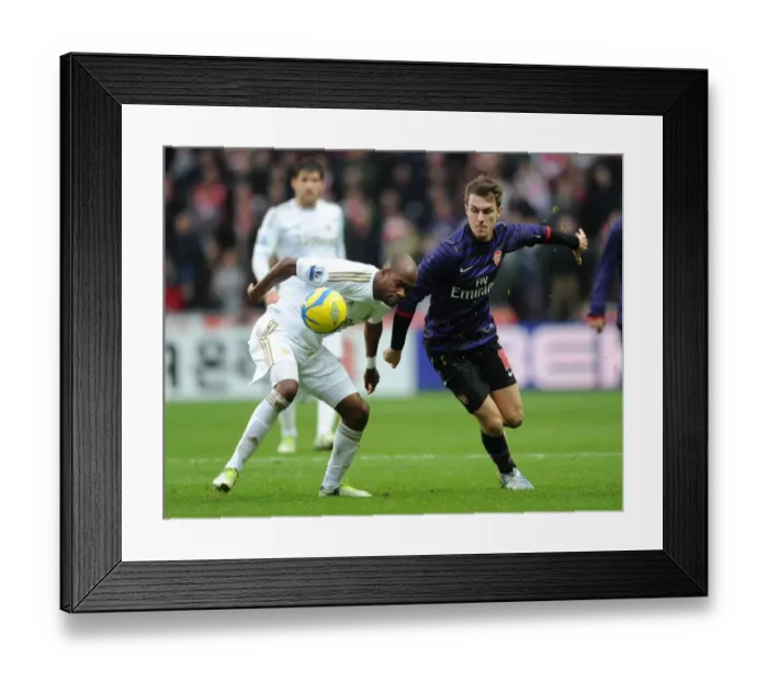 Framed Print : Arsenal's Aaron Ramsey Closes In on Swansea's Dwight Tiendalli in FA Cup Showdown
