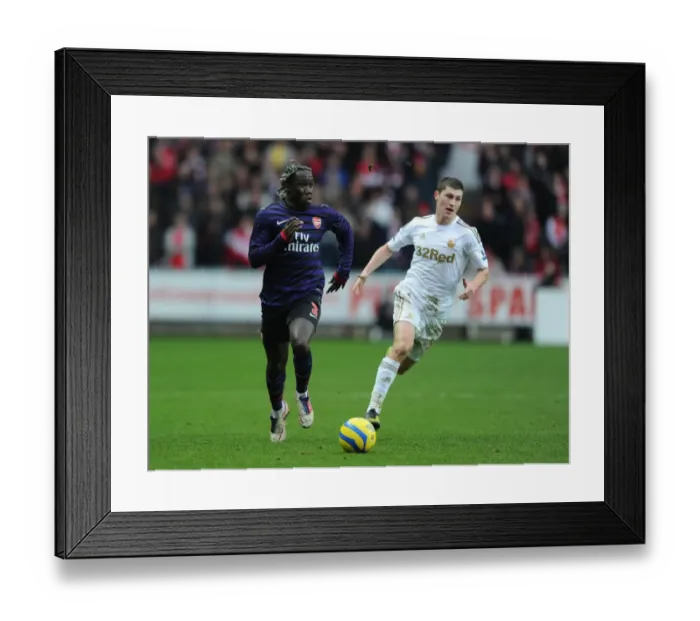 Framed Print : Bacary Sagna Outmaneuvers Ben Davies in FA Cup Clash: Swansea vs Arsenal Framed Print : Bacary Sagna Outmaneuvers Ben Davies in FA Cup Clash: Swansea vs Arsenal