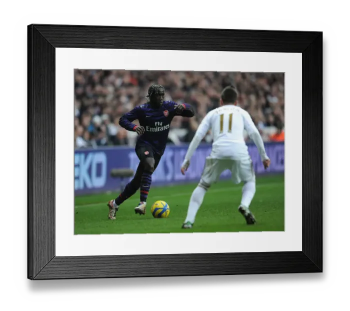 Framed Print : Battling Duels: Sagna vs Hernandez - Swansea v Arsenal, FA Cup 3rd Round
