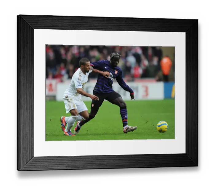 Framed Print : Bacary Sagna vs Wayne Routledge: Clash at the Liberty Stadium - Swansea v Arsenal, FA Cup 3rd Round