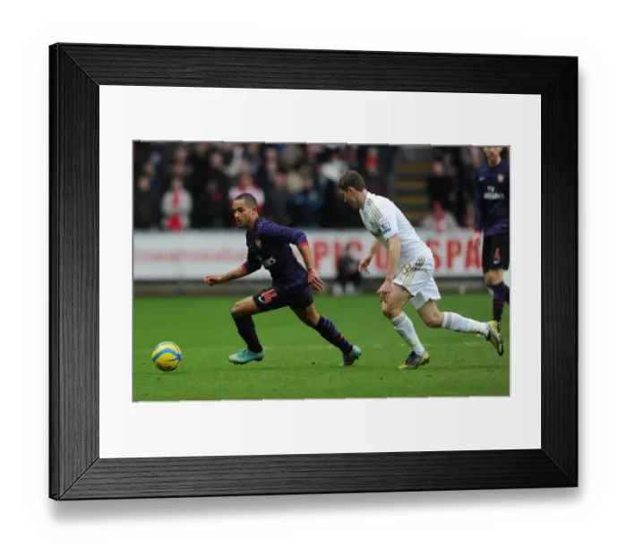 Framed Print : Theo Walcott Outmaneuvers Ben Davies in FA Cup Clash: Swansea vs. Arsenal (2012-13)