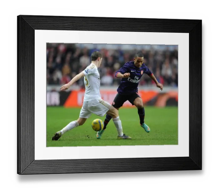 Framed Print : Theo Walcott vs Ben Davies: Clash in the FA Cup Third Round between Swansea and Arsenal