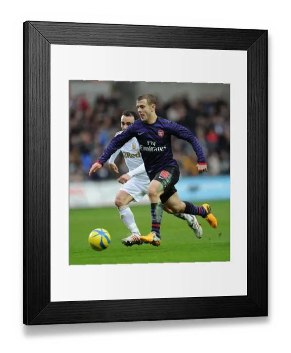 Framed Print : Jack Wilshere vs. Leon Britton: Battle in the FA Cup Third Round between Swansea and Arsenal Framed Print : Jack Wilshere vs. Leon Britton: Battle in the FA Cup Third Round between Swansea and Arsenal