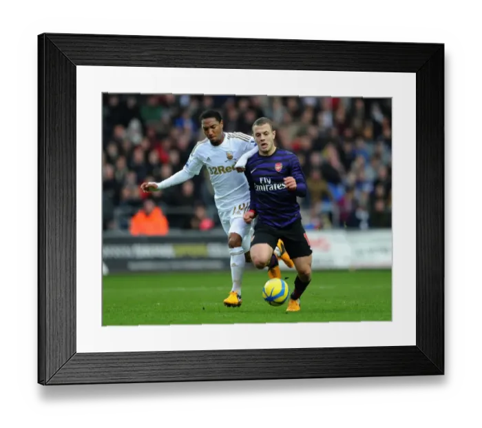 Framed Print : Jack Wilshere vs. Jonathan de Guzman: Swansea v Arsenal - FA Cup Third Round Framed Print : Jack Wilshere vs. Jonathan de Guzman: Swansea v Arsenal - FA Cup Third Round