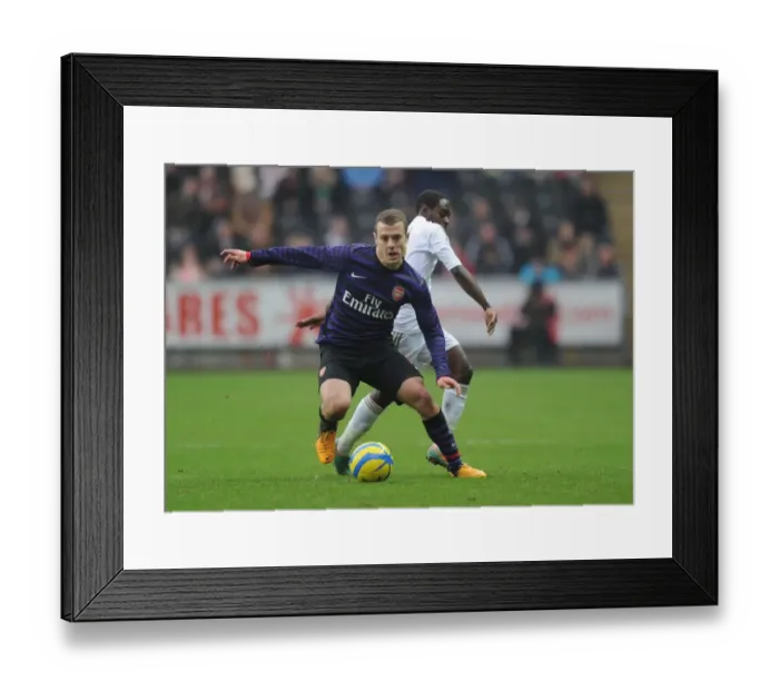 Framed Print : Jack Wilshere vs. Nathan Dyer: Battle in the FA Cup Third Round between Swansea and Arsenal Framed Print : Jack Wilshere vs. Nathan Dyer: Battle in the FA Cup Third Round between Swansea and Arsenal