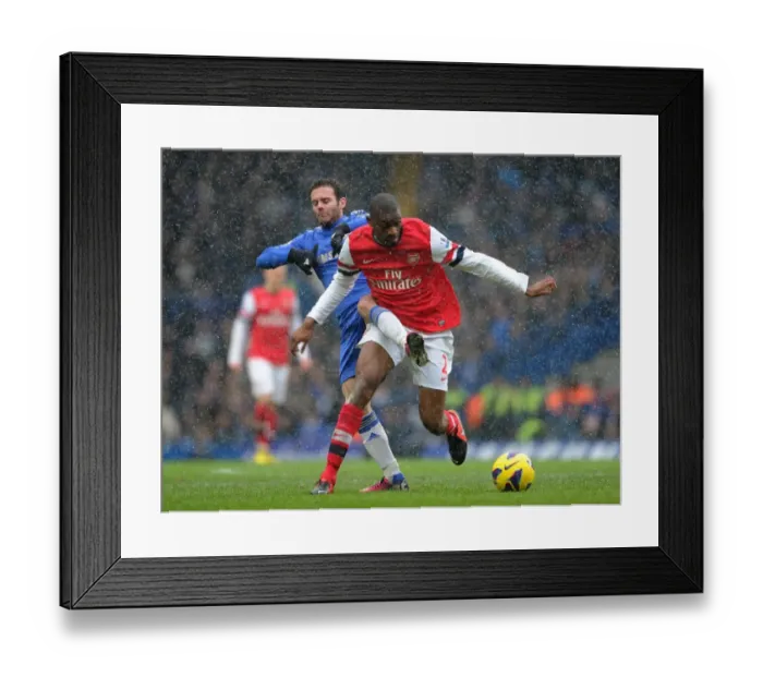 Framed Print : Abou Diaby vs Juan Mata: Intense Battle at Stamford Bridge - Premier League 2012-13