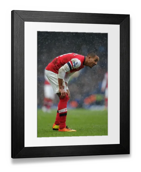Framed Print : Theo Walcott Faces Off Against Chelsea: Premier League Clash 2012-13 Framed Print : Theo Walcott Faces Off Against Chelsea: Premier League Clash 2012-13