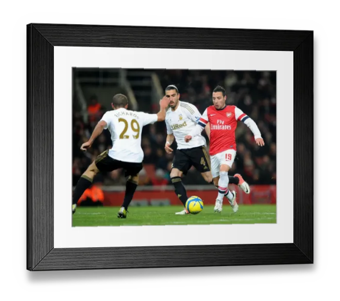Framed Print : Santi Cazorla Charges Forward Against Ashley Richards and Chico Flores in Arsenal's FA Cup Third Round Replay vs Swansea City Framed Print : Santi Cazorla Charges Forward Against Ashley Richards and Chico Flores in Arsenal's FA Cup Third Round Replay vs Swansea City