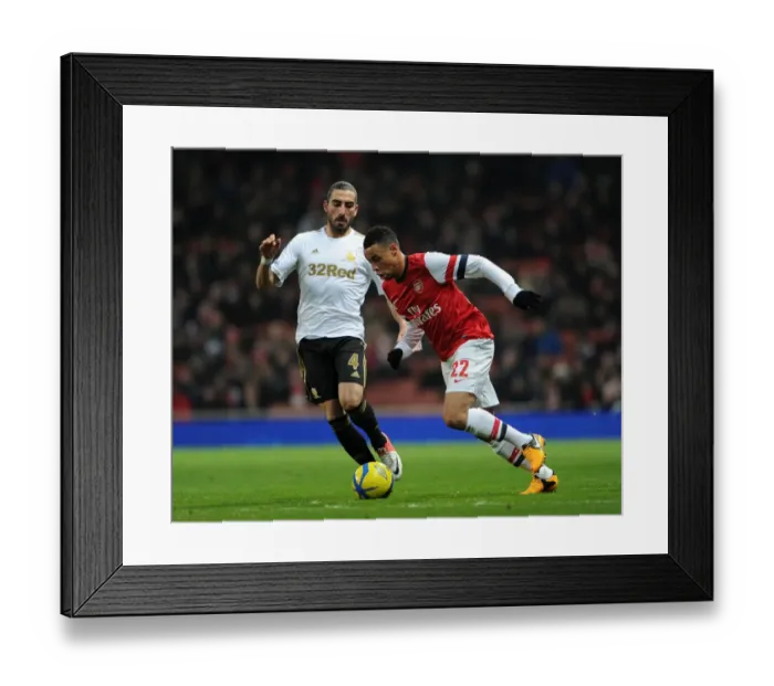 Framed Print : Arsenal's Francis Coquelin Clashes with Swansea's Chico Flores in FA Cup Third Round Replay Framed Print : Arsenal's Francis Coquelin Clashes with Swansea's Chico Flores in FA Cup Third Round Replay