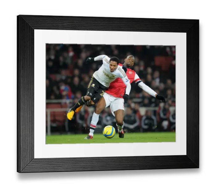 Framed Print : Abou Diaby vs. Jonathan De Guzman: Battle in the FA Cup Third Round Replay Between Arsenal and Swansea City