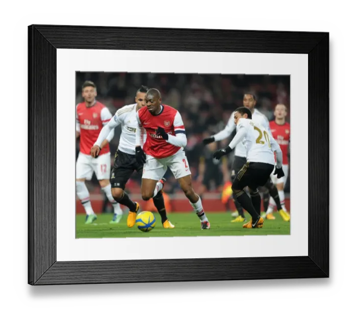 Framed Print : Abou Diaby vs. Jonathan De Guzman: FA Cup Third Round Replay Showdown at Arsenal's Emirates Stadium Framed Print : Abou Diaby vs. Jonathan De Guzman: FA Cup Third Round Replay Showdown at Arsenal's Emirates Stadium