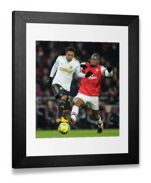 Framed Print : Abou Diaby (Arsenal) Jonathan De Guzman (Swansea). Arsenal 1: 0 Swansea City. FA Cup