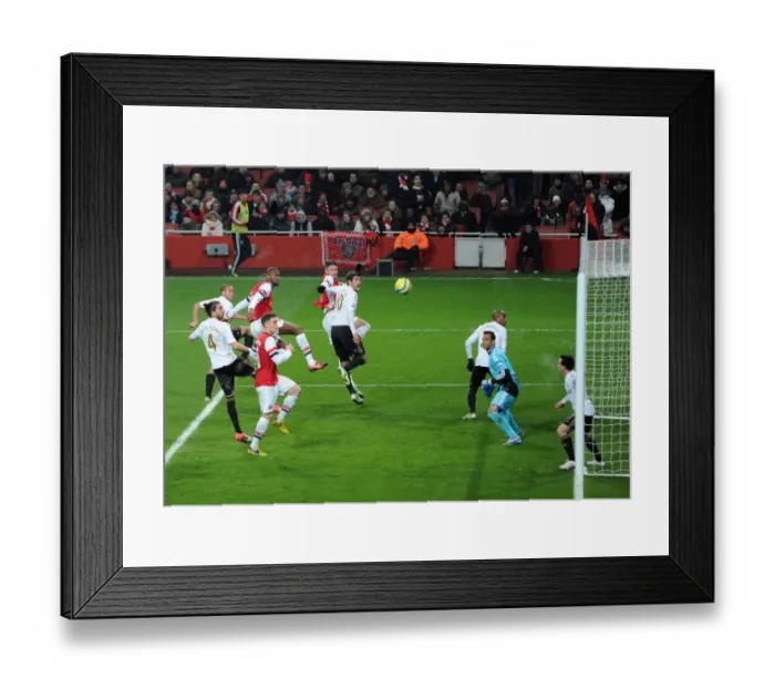 Framed Print : Abou Diaby Goes for the Header: Arsenal vs Swansea City - FA Cup Third Round Replay, 2013
