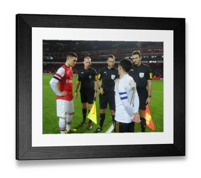 Framed Print : Thomas Vermaelen and Leon Britton Face Off: Arsenal's Victory Over Swansea City in FA Cup 3rd Round (1:0) Framed Print : Thomas Vermaelen and Leon Britton Face Off: Arsenal's Victory Over Swansea City in FA Cup 3rd Round (1:0)