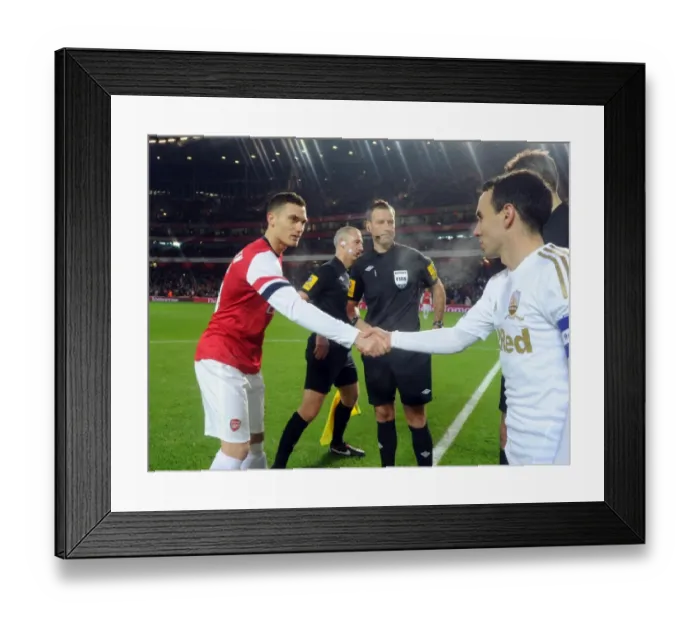 Framed Print : Thomas Vermaelen (Arsenal) Leon Britton (Swansea) with the officials. Arsenal 1: 0 Swansea City Framed Print : Thomas Vermaelen (Arsenal) Leon Britton (Swansea) with the officials. Arsenal 1: 0 Swansea City