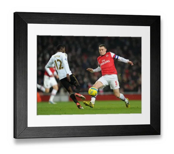 Framed Print : Arsenal vs Swansea: Thomas Vermaelen Tackles Nathan Dyer in FA Cup Third Round Replay Framed Print : Arsenal vs Swansea: Thomas Vermaelen Tackles Nathan Dyer in FA Cup Third Round Replay