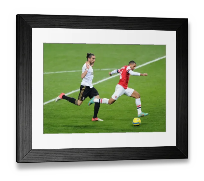 Framed Print : Arsenal's Theo Walcott Faces Off Against Swansea's Chico Flores in FA Cup Third Round Replay
