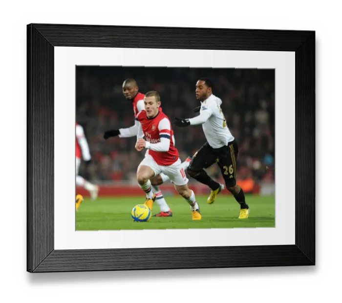 Framed Print : Jack Wilshere Surges Past Kemy Agustien in Arsenal's FA Cup Victory over Swansea Framed Print : Jack Wilshere Surges Past Kemy Agustien in Arsenal's FA Cup Victory over Swansea