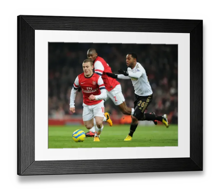 Framed Print : Jack Wilshere's Electrifying Run: Arsenal's Midfield Maestro Outshines Swansea's Agustien in FA Cup Third Round Replay