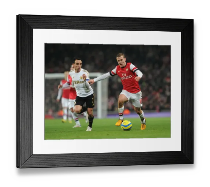 Framed Print : Arsenal's Jack Wilshere Clashes with Swansea's Leon Britton in FA Cup Third Round Replay Framed Print : Arsenal's Jack Wilshere Clashes with Swansea's Leon Britton in FA Cup Third Round Replay