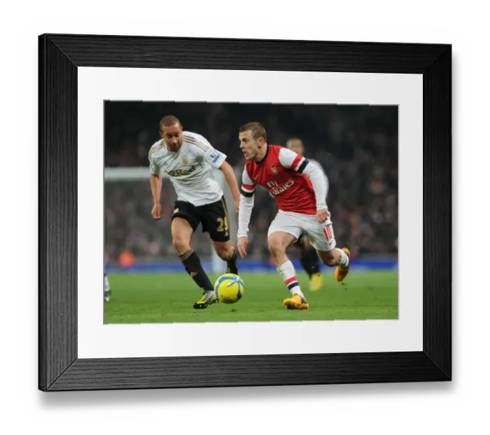 Framed Print : Arsenal's Jack Wilshere Faces Off Against Swansea's Ashley Richards in FA Cup Third Round Replay