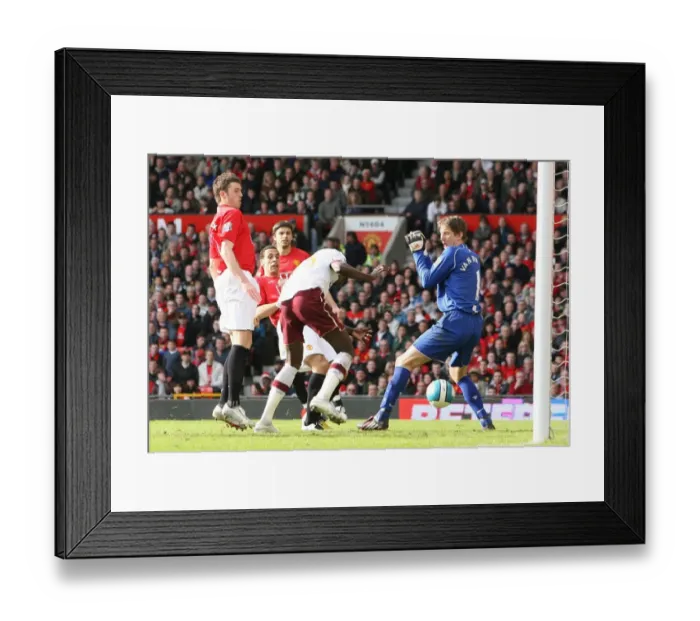 Framed Print : Emmanuel Adebayor heads past Manchester United goalkeeper Edwin van der Sar to score the Arsenal goal. Manchester United 2: 1 Arsenal, Barclays Premier League, Old Trafford, Manchester, 13  /  4  /  2008. Credit : Stuart MacFarlane  /  Arsenal