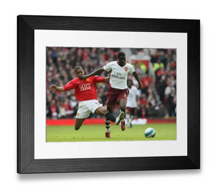 Framed Print : Clash of Titans: Eboue vs. Evra in Manchester United's 2:1 Victory over Arsenal, 2008 Framed Print : Clash of Titans: Eboue vs. Evra in Manchester United's 2:1 Victory over Arsenal, 2008