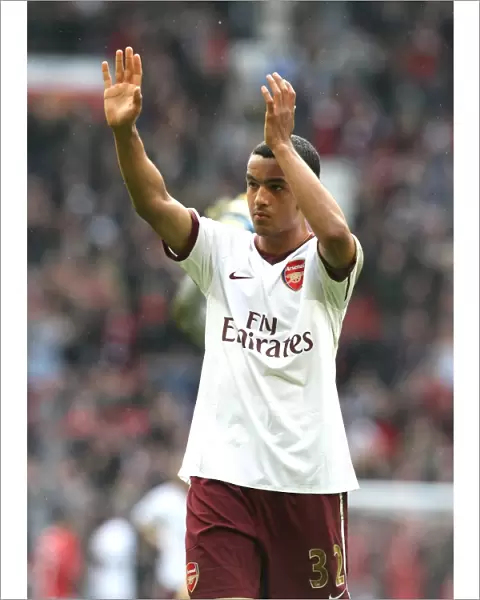 Theo Walcott waves to the Arsenal fabs after the match