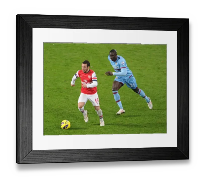 Framed Print : Santi Cazorla Outruns Mohamed Diarra: Arsenal vs. West Ham United, Premier League 2012-13